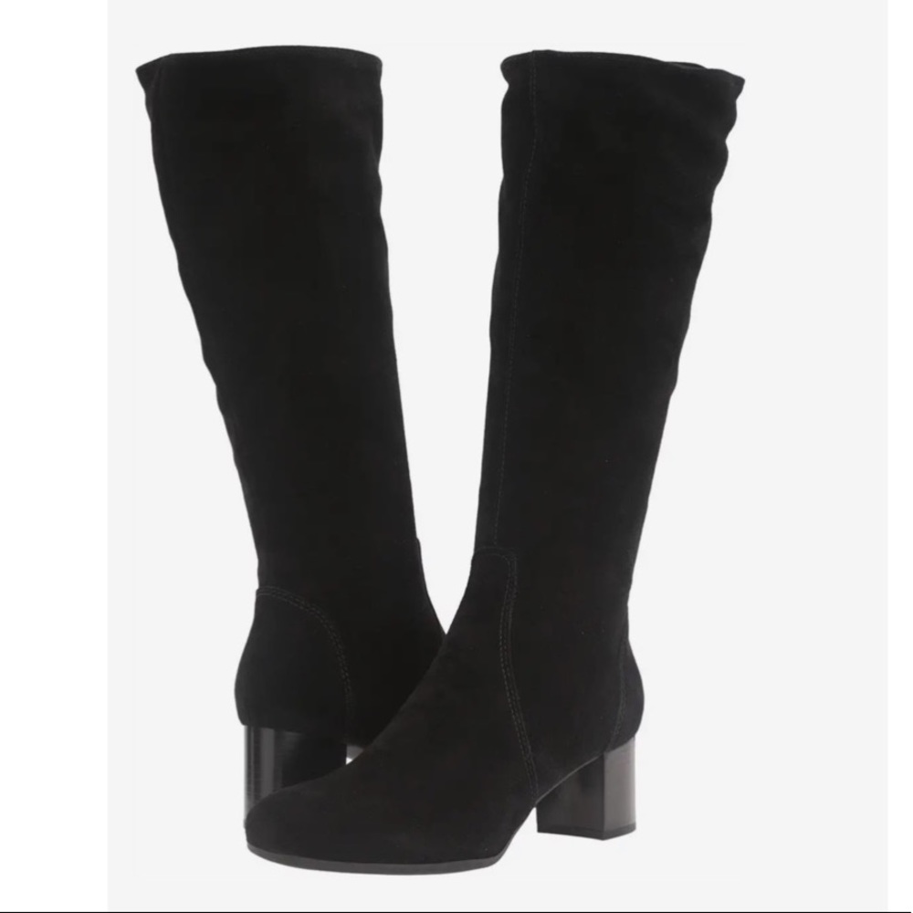 Italian calf leather heeled boots with waterproof construction rubber soles.